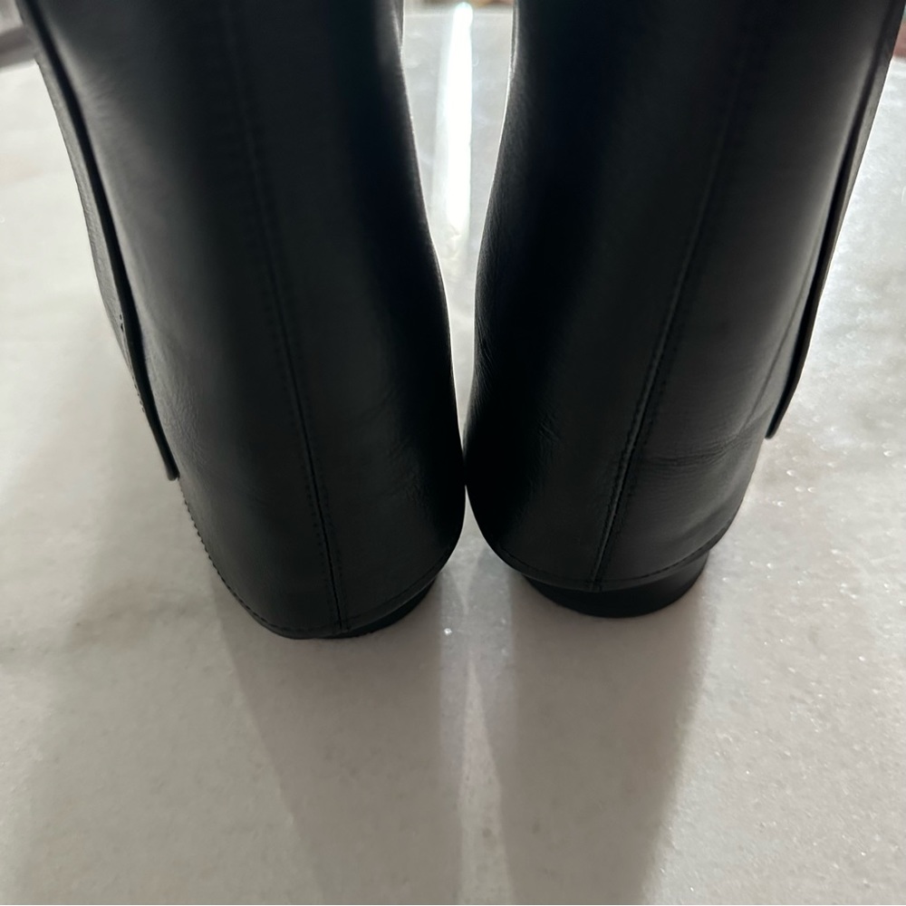 CHANEL Black Leather Knee-High Boots with Gold CC Accent - Picture 4 of 8